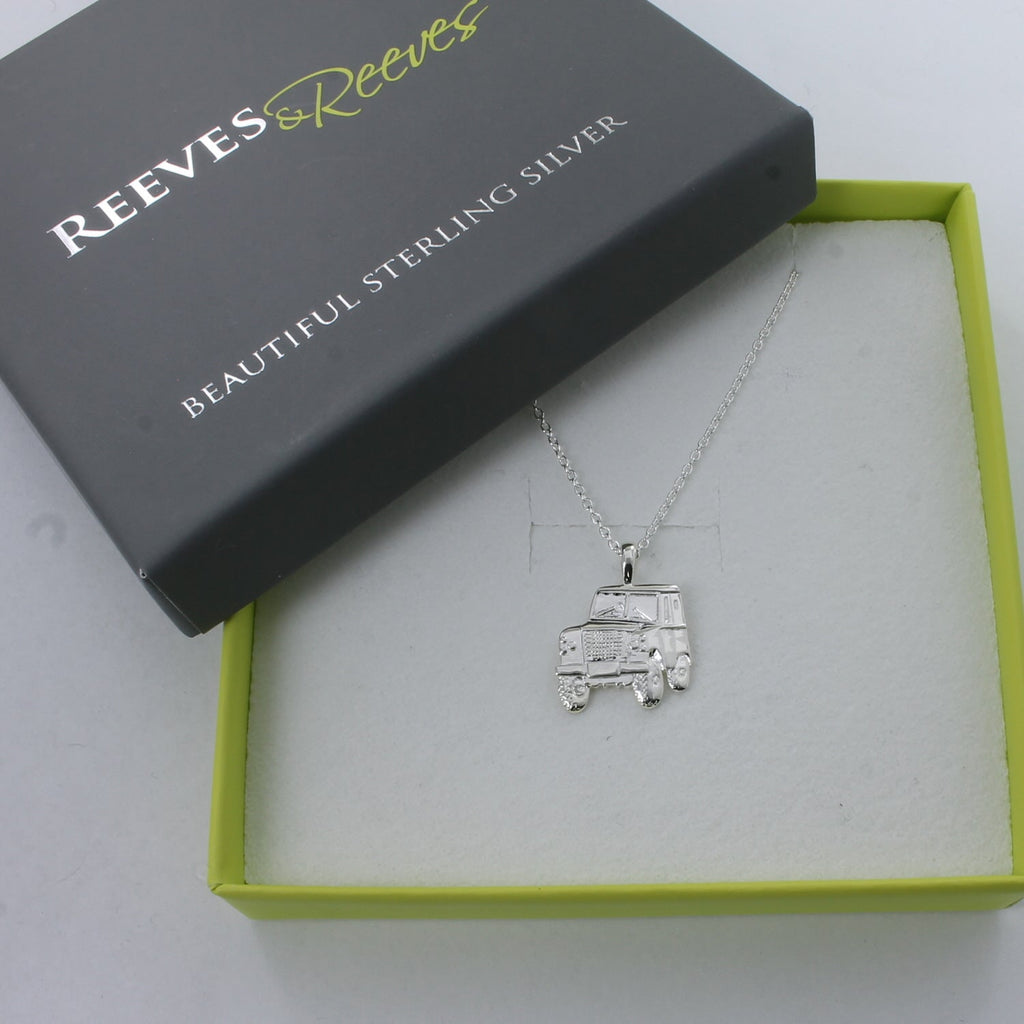 A sterling silver Landrover necklace, 2dimensional in style and hung on a silver chain, shown in a Reeves & Reeves box.