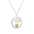 A circular pendant with cut out design to mimic an oak tree inside, with a gold plated squirrel sat underneath the tree. The design hangs on a sterling silver adjustable chain.