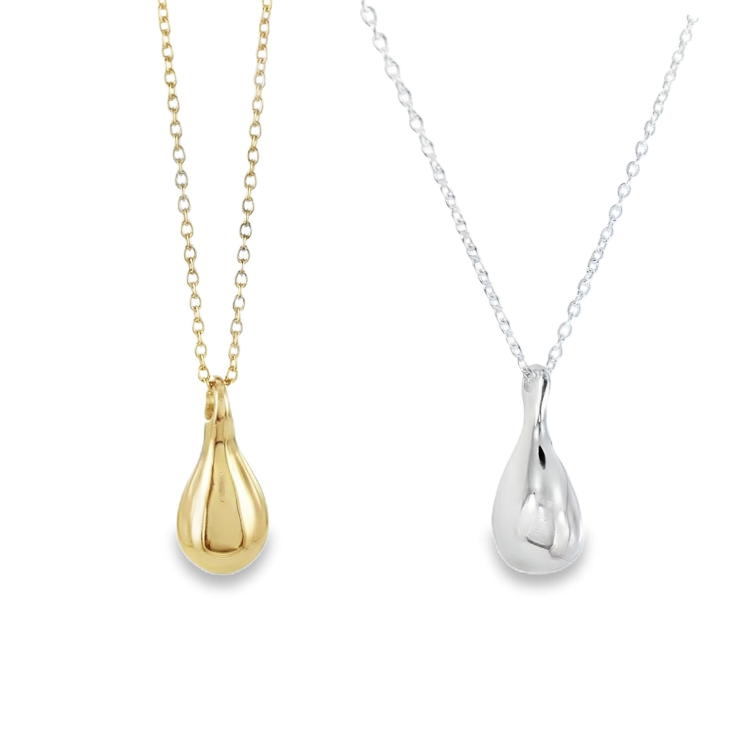 Gold and silver teardrop pendants on chains against a white background