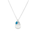 A silver pendant necklace featuring a teardrop-shaped high shine silver pendant with a smaller pear shaped turquoise blue stone and another pear drop shape with a hammered finish. All suspended from a delicate silver chain.