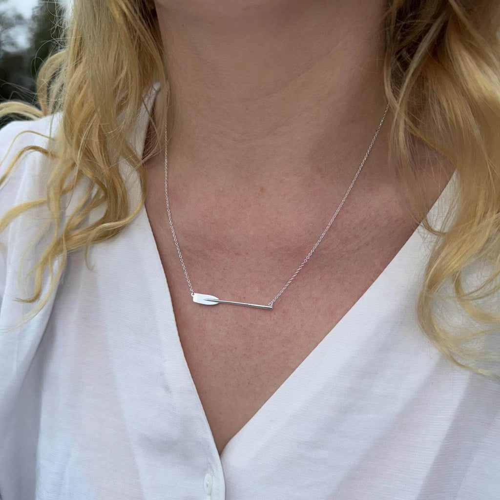 Sterling Silver Gig oar Necklace sat centrally on a fine silver chain and worn on a model.