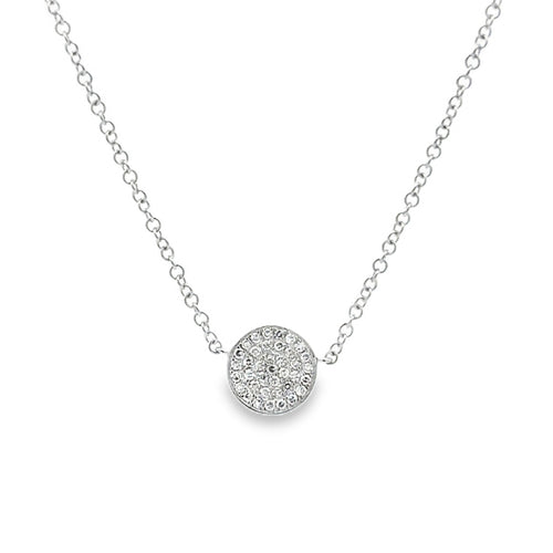 A delicate silver chain necklace featuring a round pavé pendant with small central stones, displayed on a clean white background.