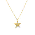 A gold star pendant necklace adorned with small clear diamonds suspended from a delicate gold chain against a solid white background.