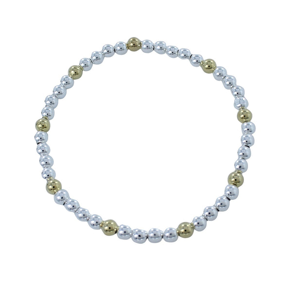 Bracelet with sterling silver beads which has 18ct gold plate beads interspersed along the elastic.