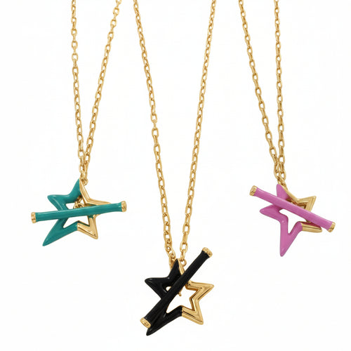 Three sterling silver star gold plated star necklaces hanging on gold chains. Each necklace has a star as the central feature, half coated in coloured enamel. Choose from turquoise, black or pink. The stars have matching enamel T bars through the centre as the clasp.