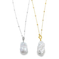 Two necklaces, one with a silver beaded chain and one with a gold plated beaded chain. Both with a baroque pearl hanging from the bottom of the chains.