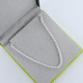 Silver Bobble Necklace shown in a Reeves & Reeves grey and green branded gift box.
