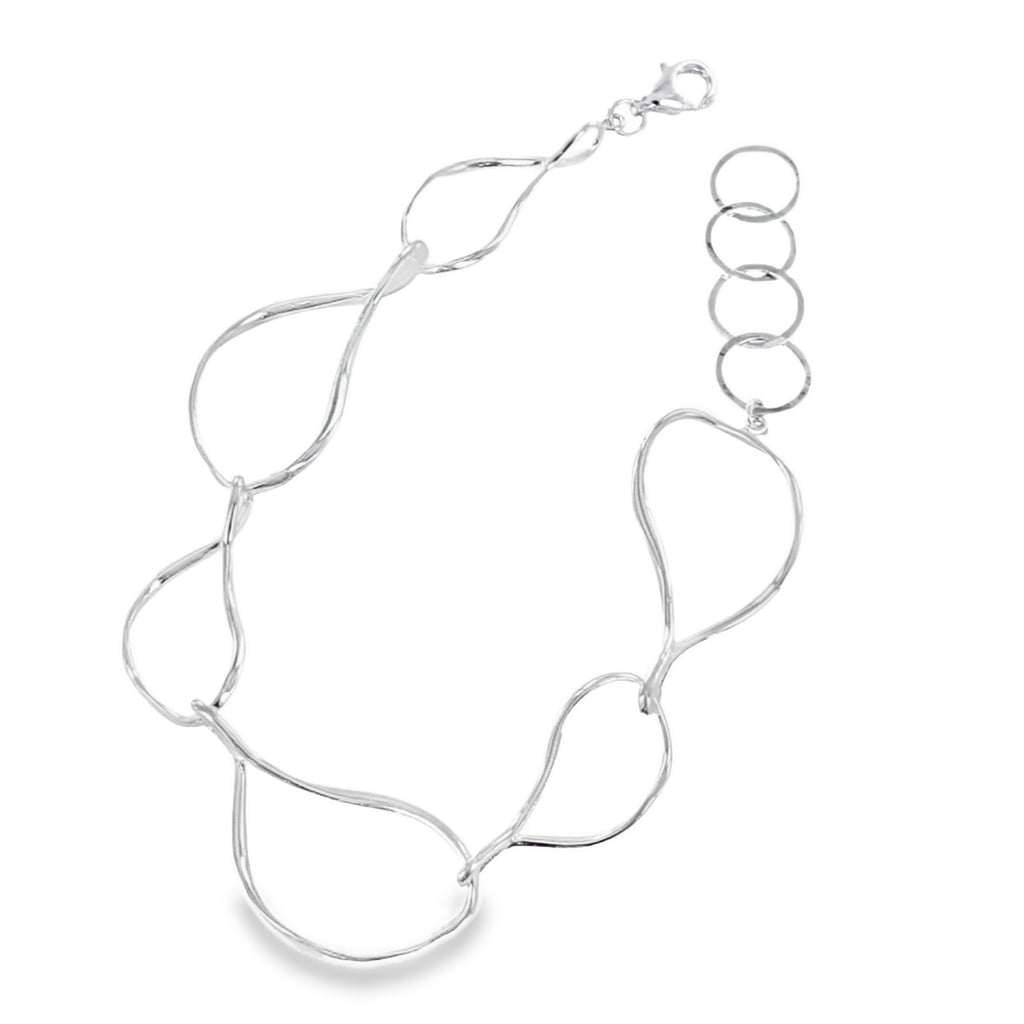 A sterling silver bracelet with pear shaped links in varying sizes, finished with a lobster clasp and four circular adjustable links.