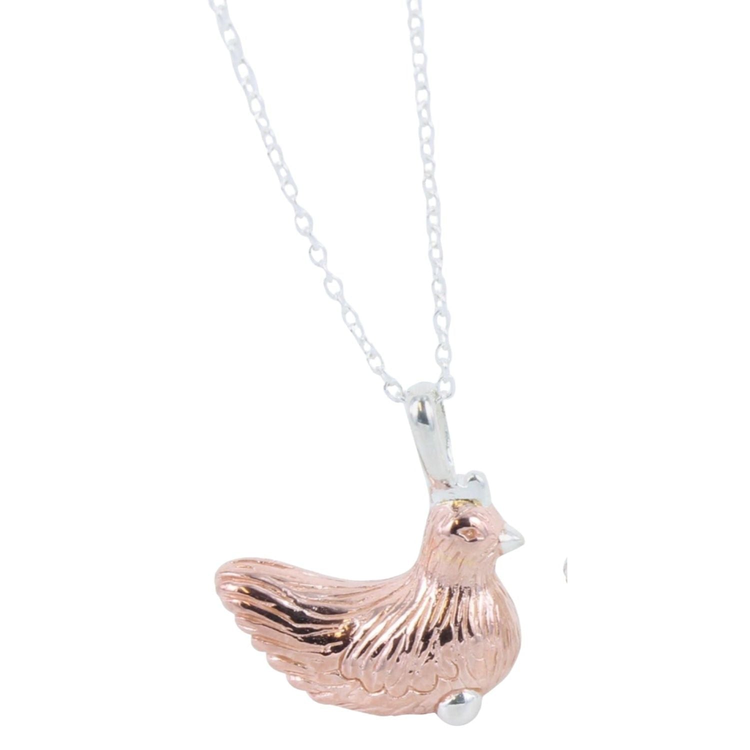 A Sterling Silver Chicken Necklace in rose gold plating, sat on a silver adjustable chain.