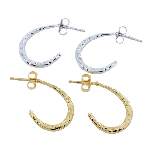 Two pairs of hoop earrings, one silver and one gold plate with a hammered finish. Butterfly backs on both pairs of earrings.