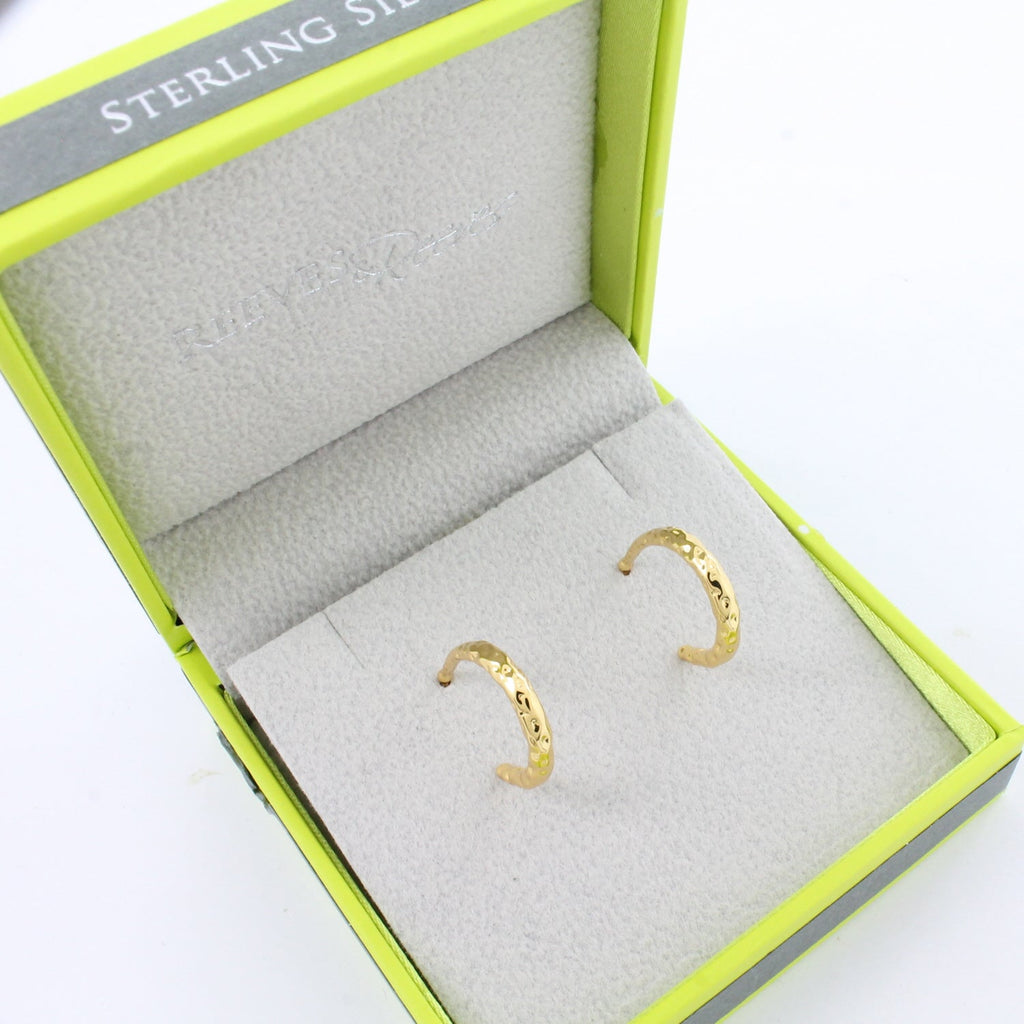 Gold plated textured hoop earrings in a Reeves & Reeves grey and green branded gift box.