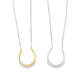 Two Necklaces, one Silver and one gold plate in a horseshoe design. The horseshoe has one tiny cubic zirconia stone on it and they hang centrally on silver adjustable chains.