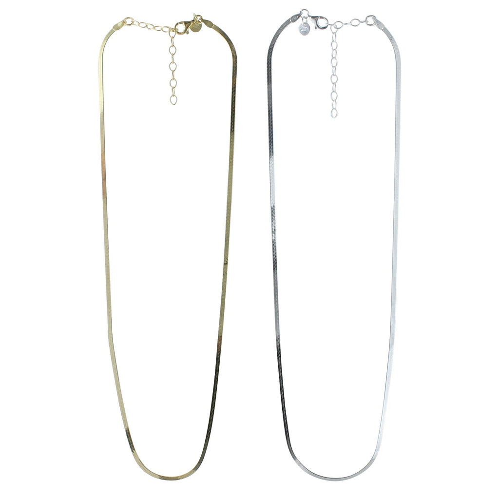 Two fine snake chain necklaces, one with a gold plate finish and the other in silver, both with adjustable lengths and presented against a white background.