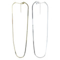 Two fine snake chain necklaces, one with a gold plate finish and the other in silver, both with adjustable lengths and presented against a white background.