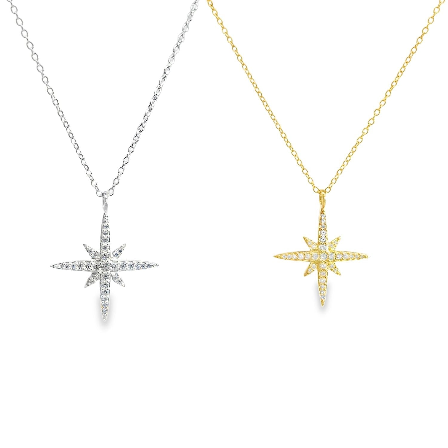Two sparkly eight point star pendants, one in silver, one in gold plate, both filled with cubic zirconia stones and hanging on adjustable chains.