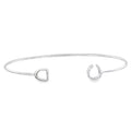 A fine sterling silver band, finished with a horseshoe at one end and a stirrup at the other.