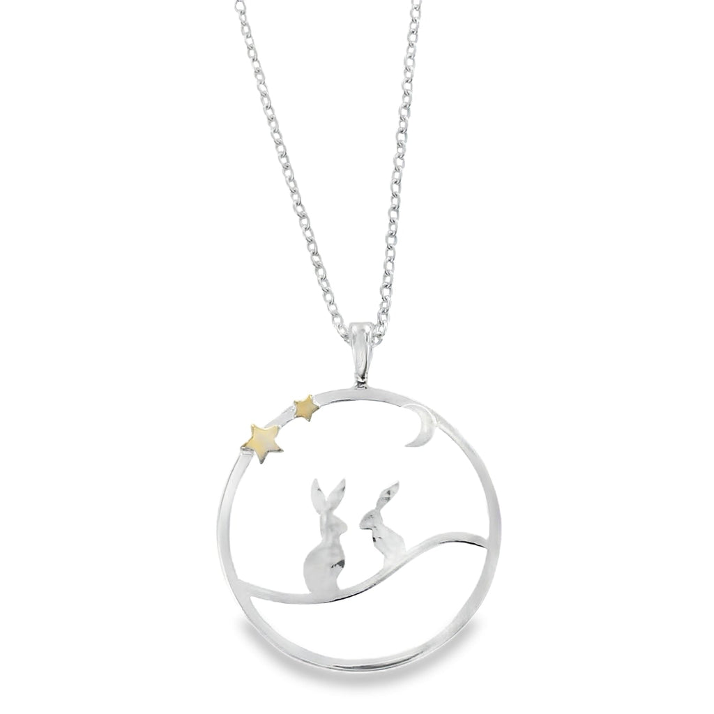 Sterling Silver Moonlit Hares Necklace, two silver hares sat in a circle outline underneath a silver moon and two gold plate stars. The pendant hangs on an adjustable silver chain. Nature inspired gift for her.