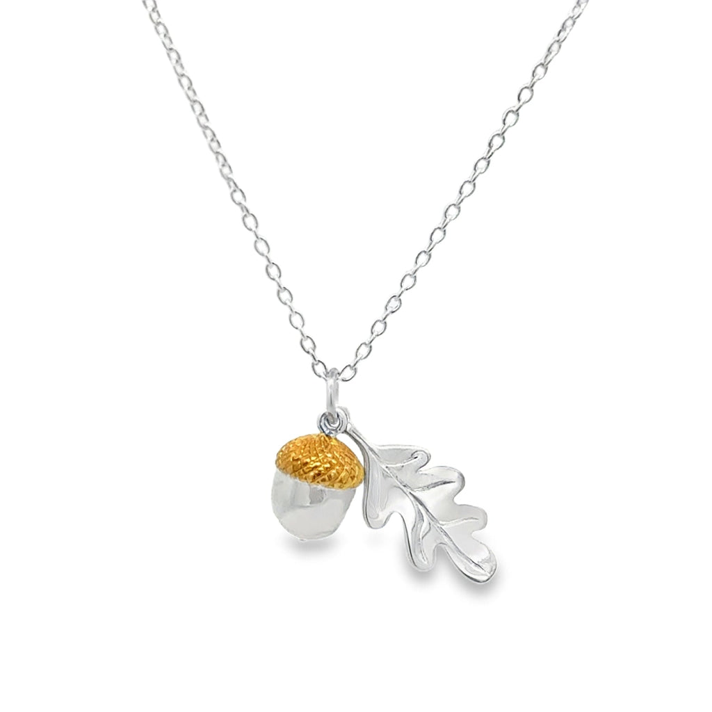 A Sterling Silver and Gold Plate Acorn Charm sat with a Silver Oak Leaf, both hanging together from a fine silver adjustable chain.