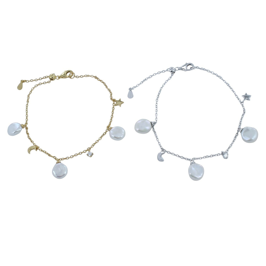 Two bracelets, one gold and one silver, with moon and star charms with white freshwater pearls hanging from the chains.