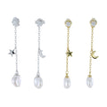 Two pairs of drop earrings in silver and gold plate. The cubic zirconia stud sits at the top with a chain hanging from it. The chain has a moon or star on each earring halfway down the chain and a freshwater white pearl hanging at the bottom.