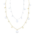 Two fine chain necklaces in sterling silver and gold plate. Both necklaces have white freshwater pearl charms interspersed with star and moon charms and cubic zirconia stones, all spaced evenly along the chain.