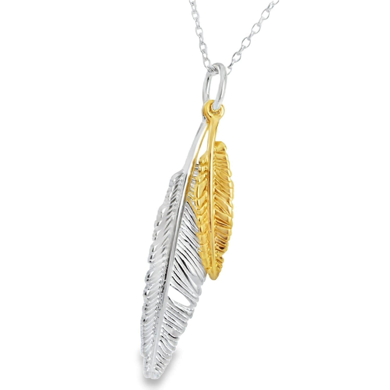 Two feather Plumage necklace in Sterling Silver and gold plate. The silver feather is slightly larger than the gold feather and they sit together on a sterling silver chain.