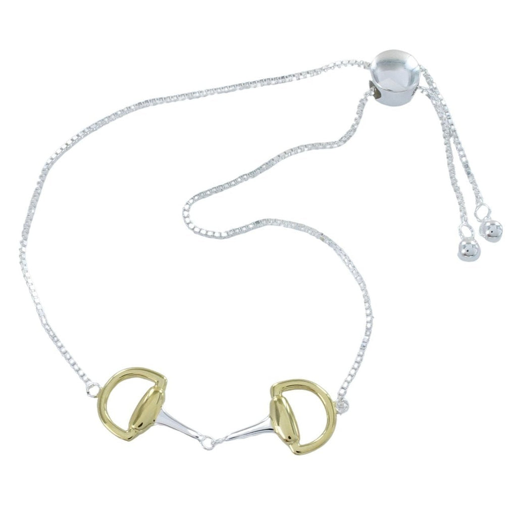 Silver snaffle bracelet with a gold plated snaffle as the central feature, sat on a box link chain with a slider toggle clasp.