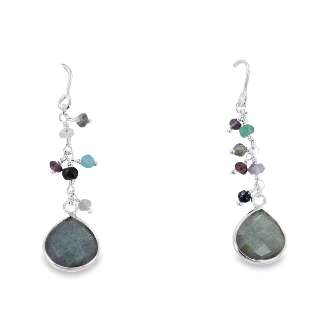 A semi precious labradorite stone in a pear shape sits at the bottom of a silver chain and hangs on silver hooks with coloured stones set down the chain.