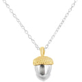 Silver acorn pendant with an 18ct gold top, hanging on a silver adjustable chain.