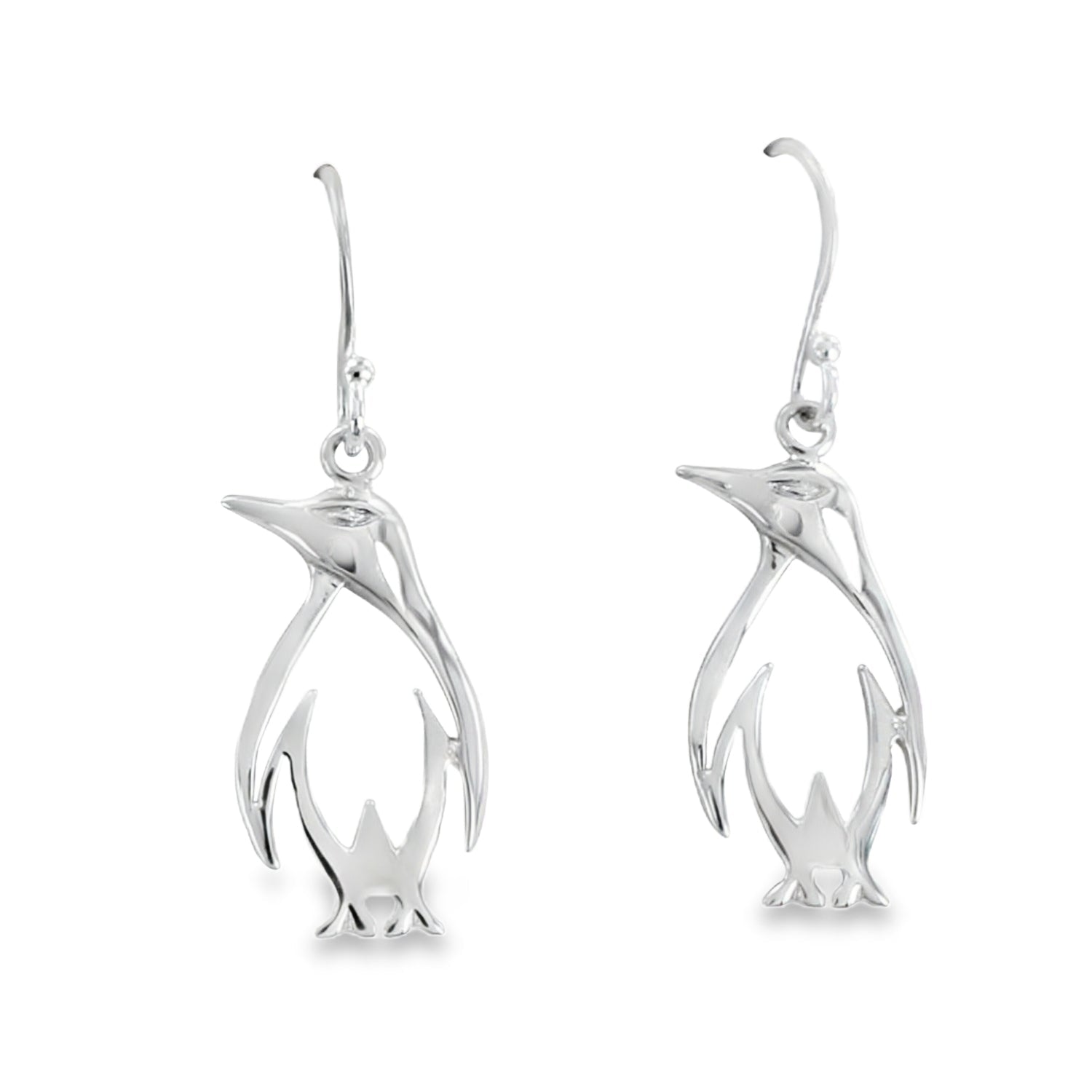 A pair of Penguin silhouette drop earrings, hanging on silver hooks.