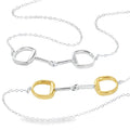 Two snaffle necklaces, one silver and one gold plated, sat centrally on a silver fine chain.