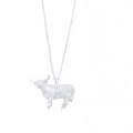 Silver Highland Cow pendant necklace hanging on a silver chain.