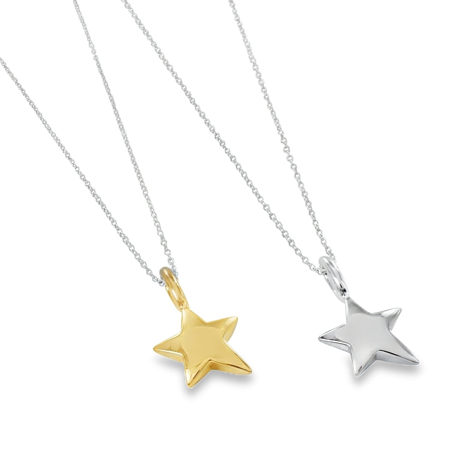 Two large, solid sterling silver star necklaces, one silver and one gold plated, hung on silver adjustable chains.