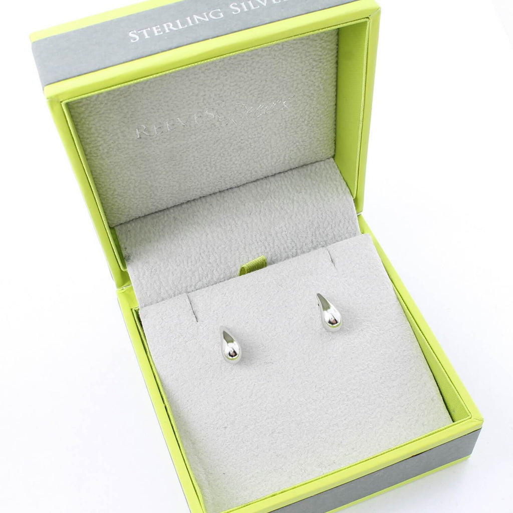 A pair of sterling silver Teardrop Stud Earrings, shown in a Reeves & Reeves gift box.
