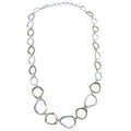 A sterling silver necklace comprised of consecutive ringlets, interspersed with 18ct gold plated rings with undulated edges.
