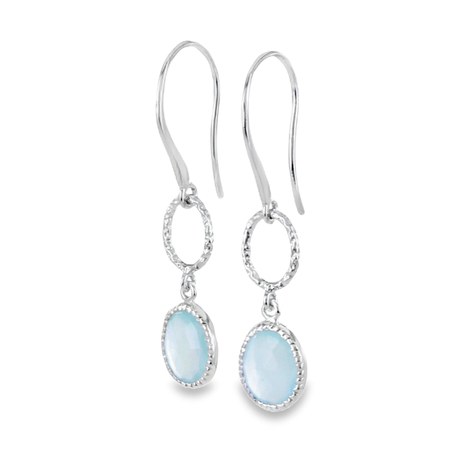 A pair of sterling silver drop earrings with textured circles hanging from silver hooks. Below the circles hangs an aqua chalcedony stone.