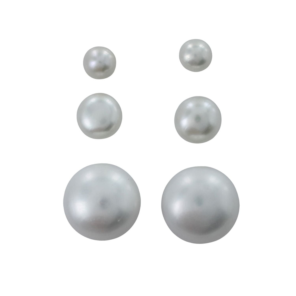 Three pairs of white freshwater pearl stud earrings in three varying sizes.