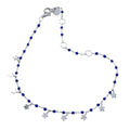 Silver fine chain Bracelet with navy blue beads and silver star charms hanging from the chain. Finished with a lobster style clasp and has adjustable features.