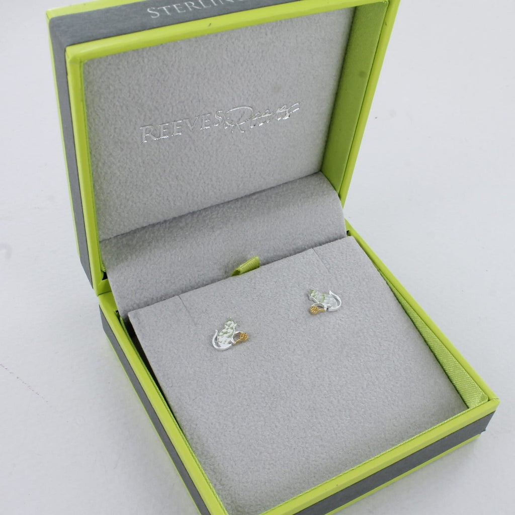 A pair of sterling silver cat stud earrings, playing with an 18ct gold plated ball of wool and shown in a Reeves & Reeves gift box.