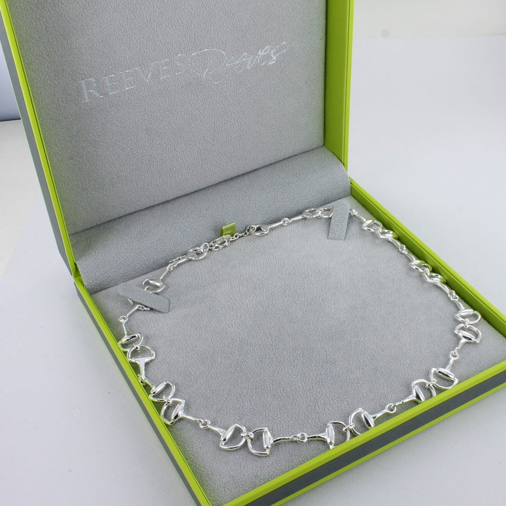 A Sterling Silver continuous snaffle necklace, finished with a lobster clasp and shown in a Reeves & Reeves grey and green gift box.
