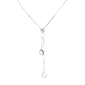 A Silver pull through style necklace, with a horseshoe and stirrup charm dangling on the silver chain.