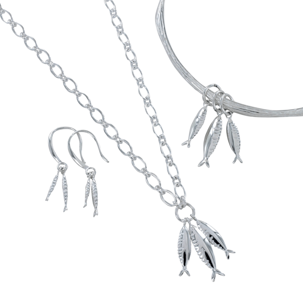 A collection of the Little Fishes pieces, a Necklace, Bangle and Drop Earrings.