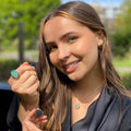Semi precious stones of labradorite and aqua chalcedony, in rings, necklaces and earrings, worn on a model.