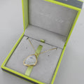 A rainbow moonstone, set in gold plating and on a gold box chain. Shown in a Reeves & Reeves grey and green branded gift box.
