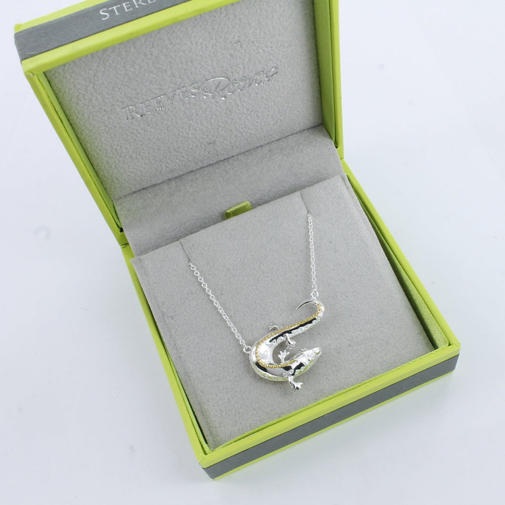 A sterling silver Newt Necklace, with 18ct gold plate detail on its back and shown in a Reeves & Reeves grey and green gift box.