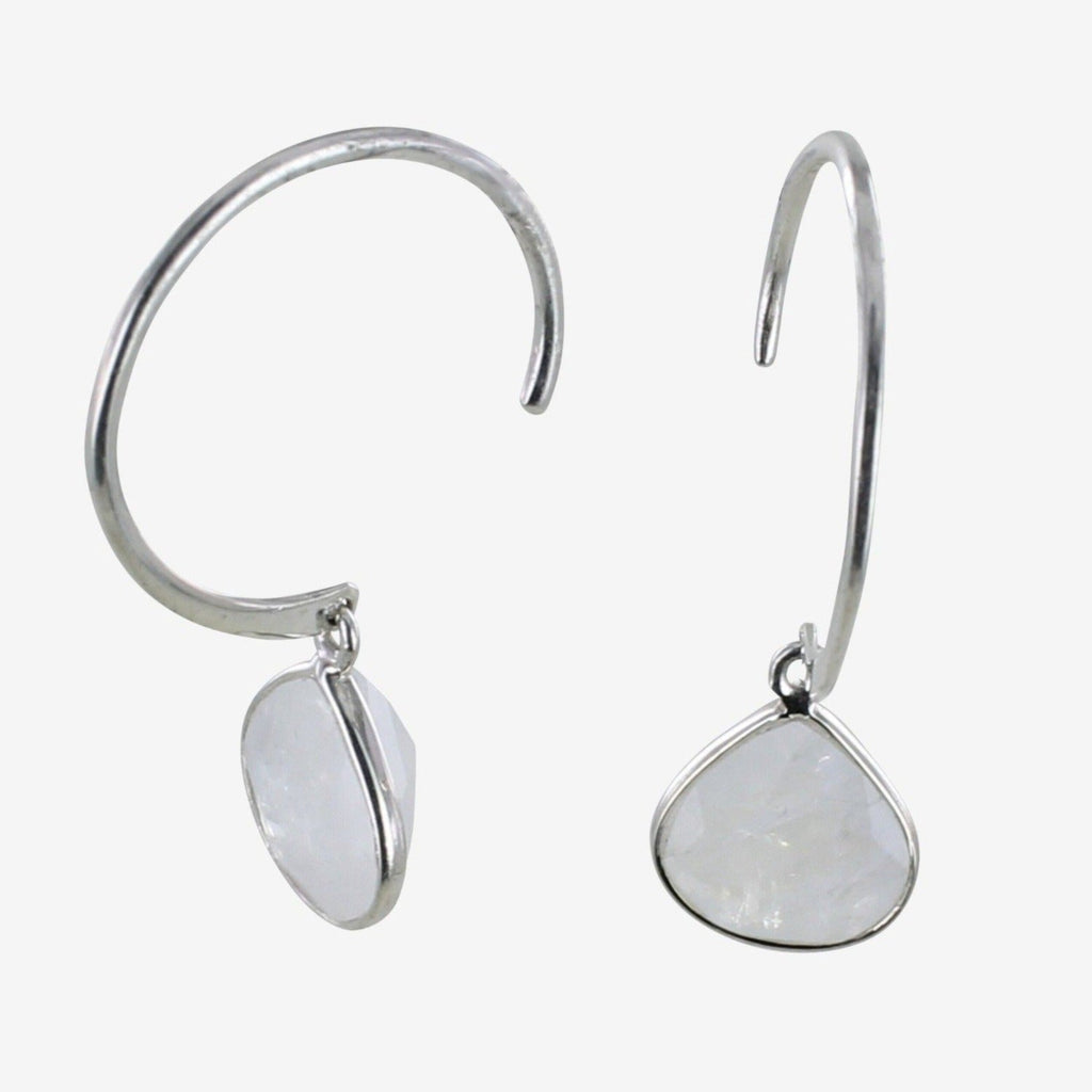 A pair of sterling silver hoop earrings with a moonstone gem in a teardrop shape hanging from the bottom of the hoop.
