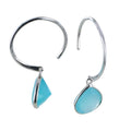 A sterling silver hoop style earring with a teardrop shaped aqua chalcedony stone hanging from the bottom.