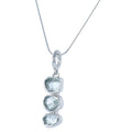 Sterling Silver rough cut aqua marine stones set in a vertical design and hung on a silver rope chain.