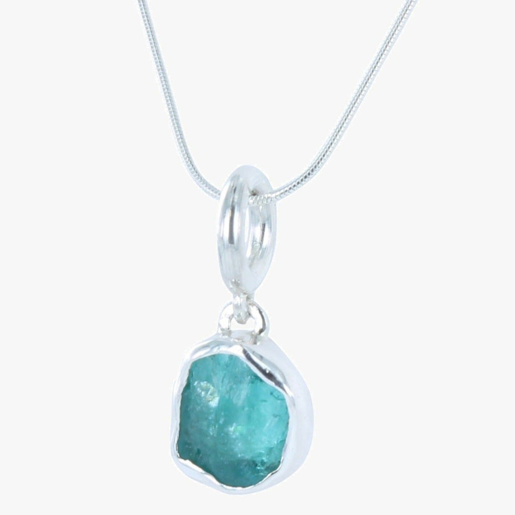 Semi precious aqua marine rough cut stone, set in sterling silver and hung on a rope style silver chain.