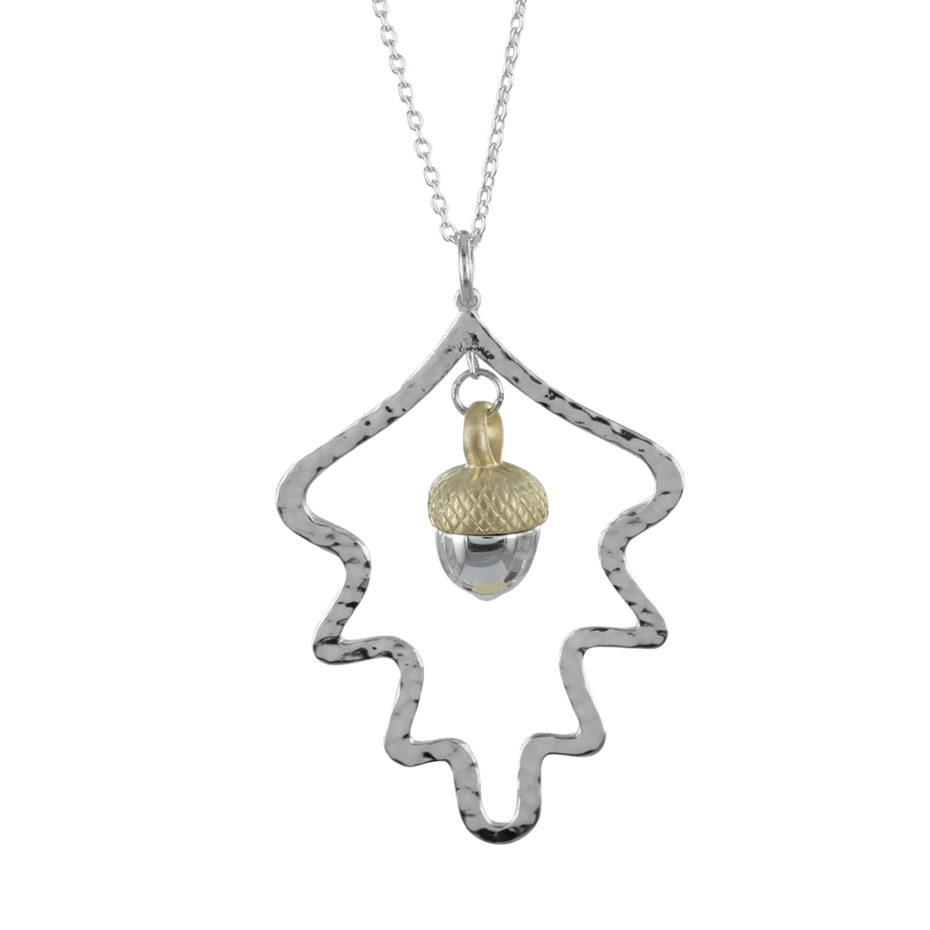 A sterling silver large oak leaf silhouette with an acorn hanging inside. The acorn has an 18ct gold plate top to it and the design hangs from an adjustable silver chain.